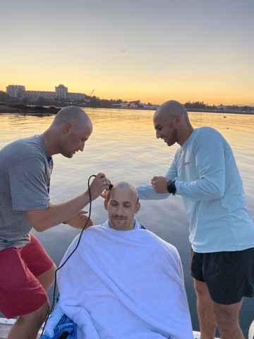 Supportive moment: Fabian's friends shaving his head during chemotherapy. A testament to friendship, resilience, and the journey from adversity to triumph. 