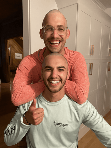 Fabian and friend post head-shave solidarity. A powerful symbol of support, friendship, and resilience.